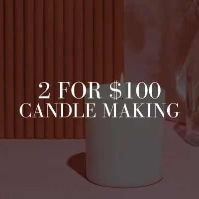 Three elegant candles from Seven Layer in assorted colors and designs, displayed together on a wooden surface.